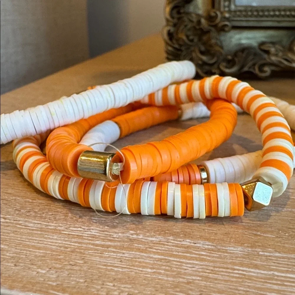 Set of 4 Orange and White Stretchy Bracelets with Gold Accents - Picture 2 of 3